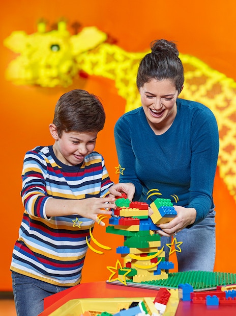 Children building with LEGO bricks at LEGOLAND® Discovery Centre Berlin.