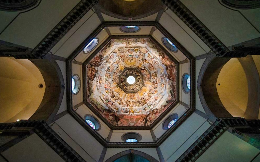 Interior view of Florence's Duomo dome with detailed frescoes, part of Uffizi and Duomo tour.