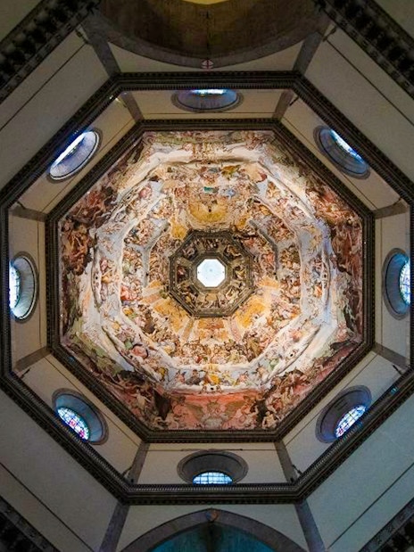Interior view of Florence's Duomo dome with detailed frescoes, part of Uffizi and Duomo tour.