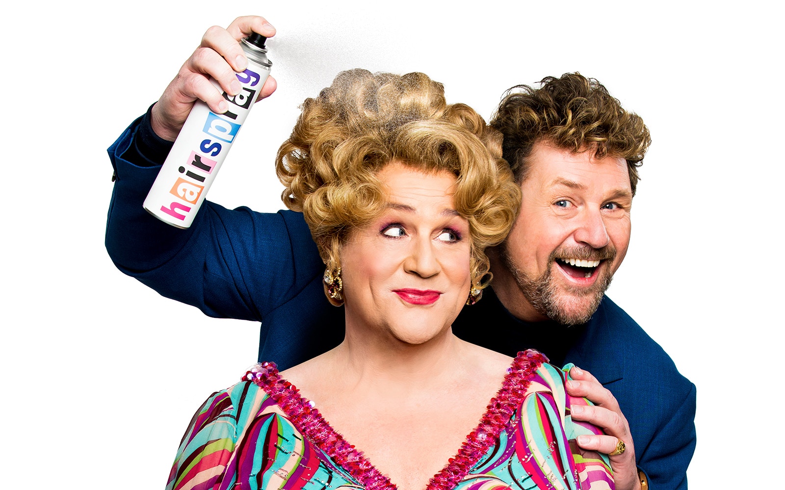 Two people smiling, one holding a can labeled "Hairspray," promoting the musical.