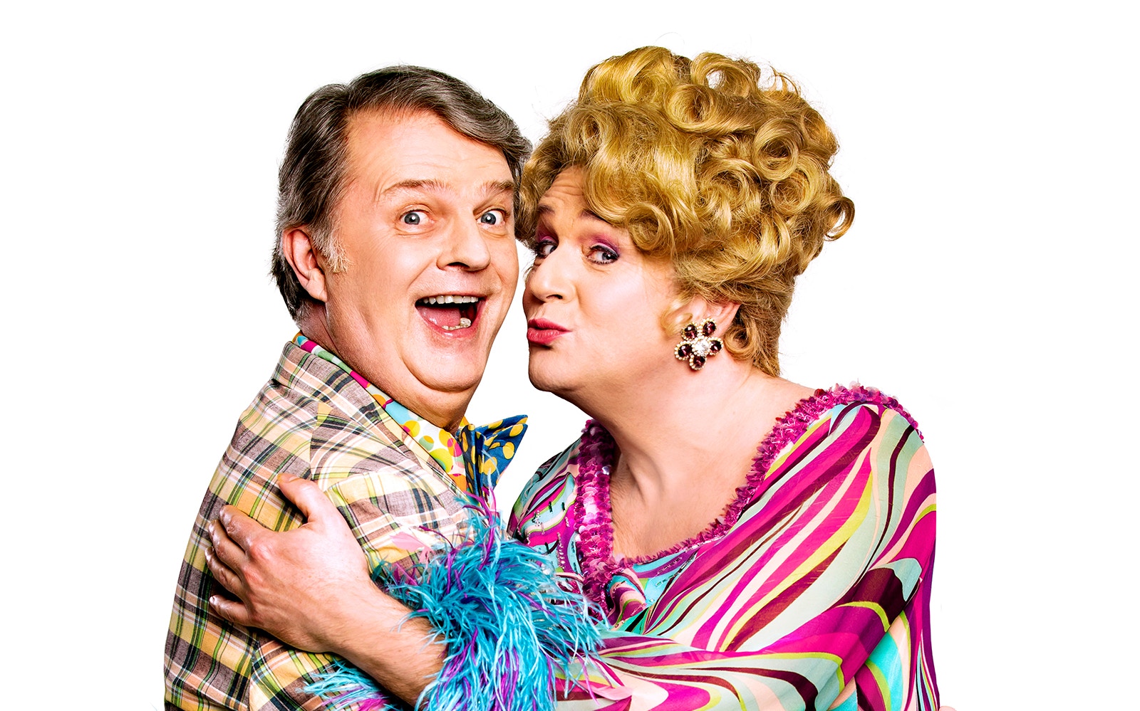 Two performers in colorful costumes from the musical "Hairspray.