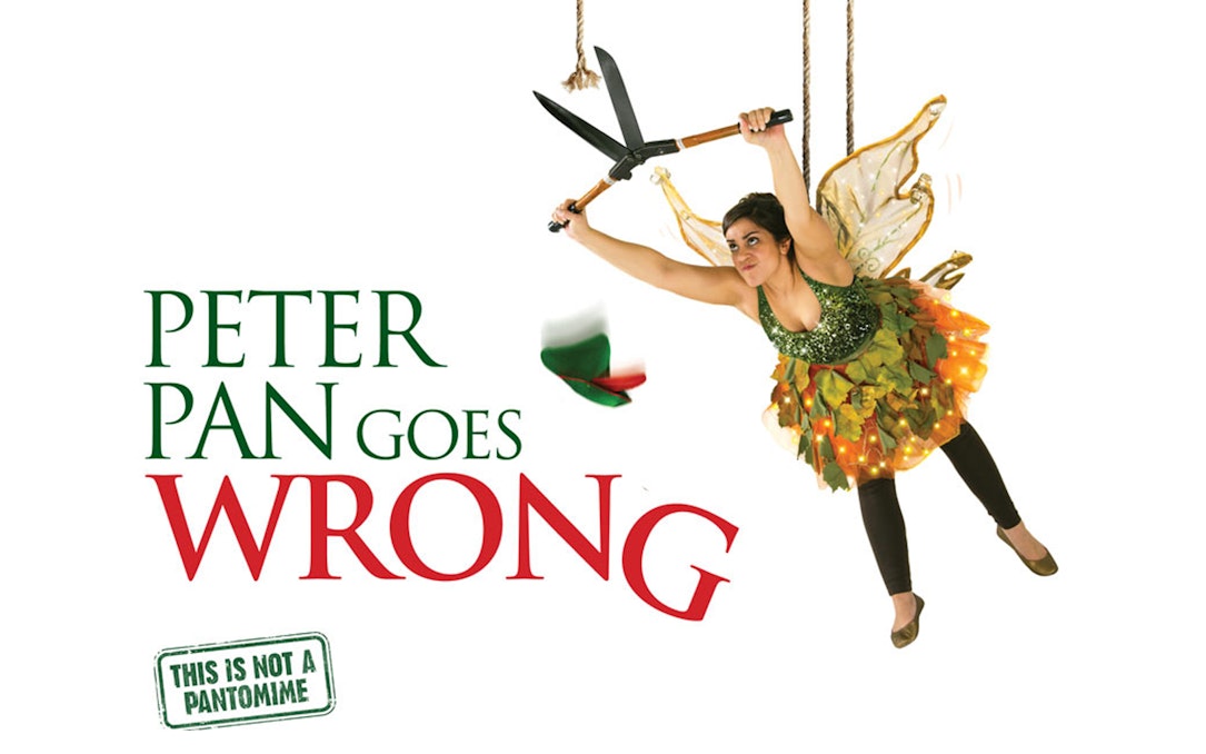 Performer in fairy costume suspended with shears, promoting "Peter Pan Goes Wrong" show.