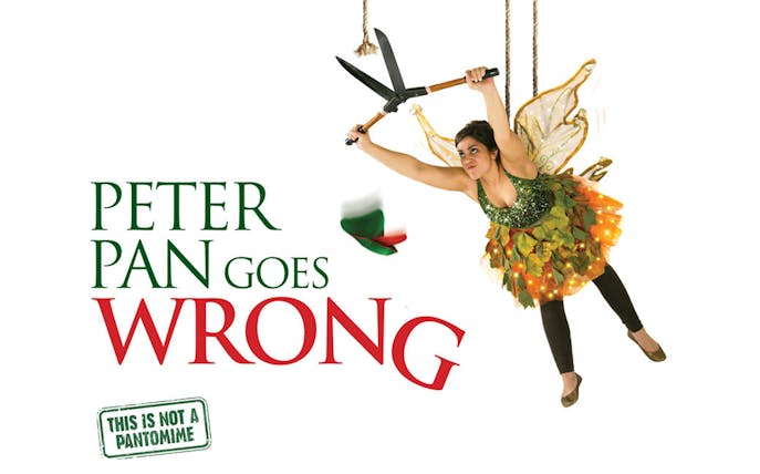 Performer in fairy costume suspended with shears, promoting "Peter Pan Goes Wrong" show.
