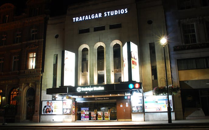 Trafalgar Studios theater exterior at night, London, featuring "The Girl Who Fell" show.