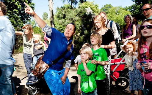 Visitors observing animals at ARTIS Royal Zoo, Amsterdam.