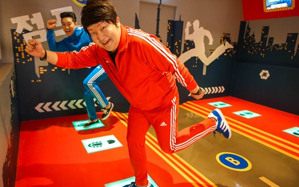 Participants enjoying interactive games at Running Man Thematic Experience Center.