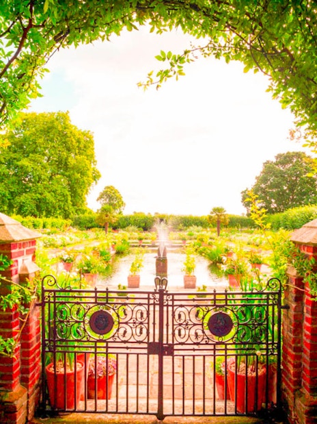 Garden view through ornate gate at Kensington Palace, part of 3 Palace Pass tour.