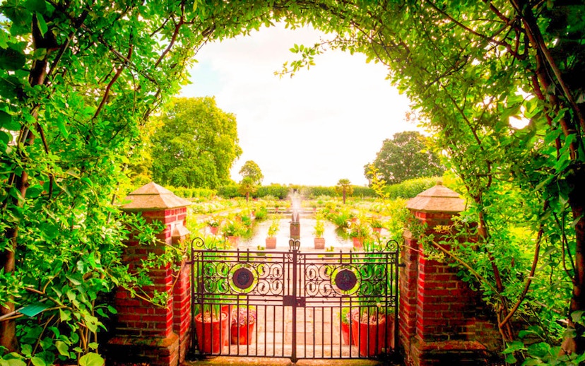 Garden view through ornate gate at Kensington Palace, part of 3 Palace Pass tour.