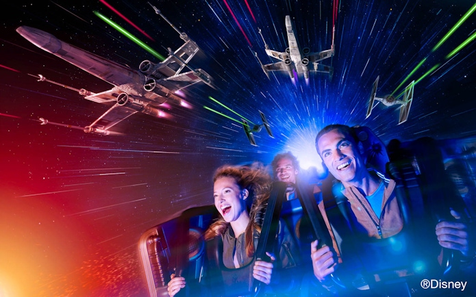 Guests enjoying a Star Wars-themed ride at Disneyland Paris.