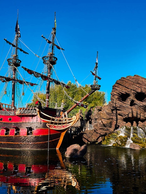 Pirate ship and skull rock at Pirates of the Caribbean, Disneyland Paris.
