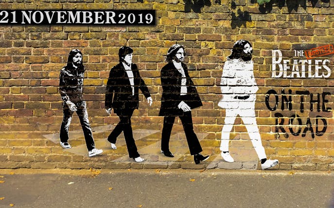 The Bootleg Beatles mural on a brick wall with "On The Road" text.