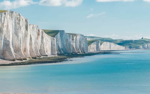 White Cliffs of Dover along the coastline under a clear sky.