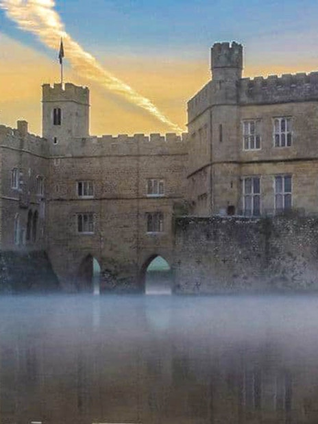Leeds Castle with mist over the moat at sunrise, part of the Leeds Castle, Canterbury Cathedral & White Cliffs of Dover Tour.