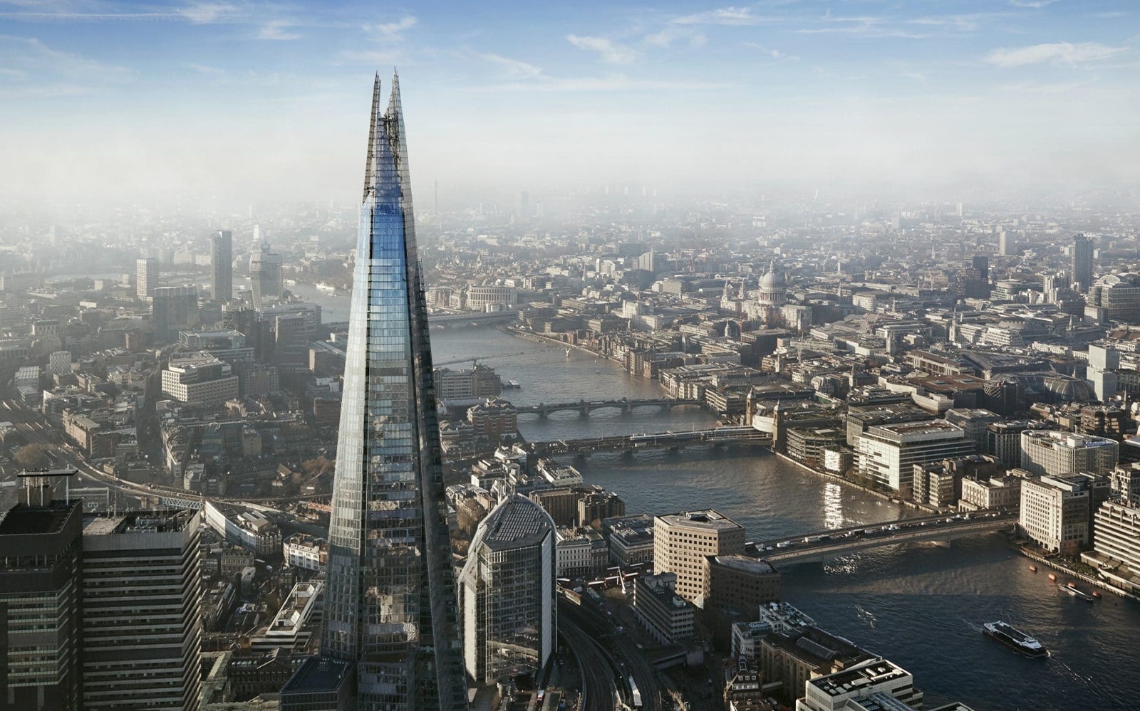 Aerial view of The Shard and London skyline with River Thames.