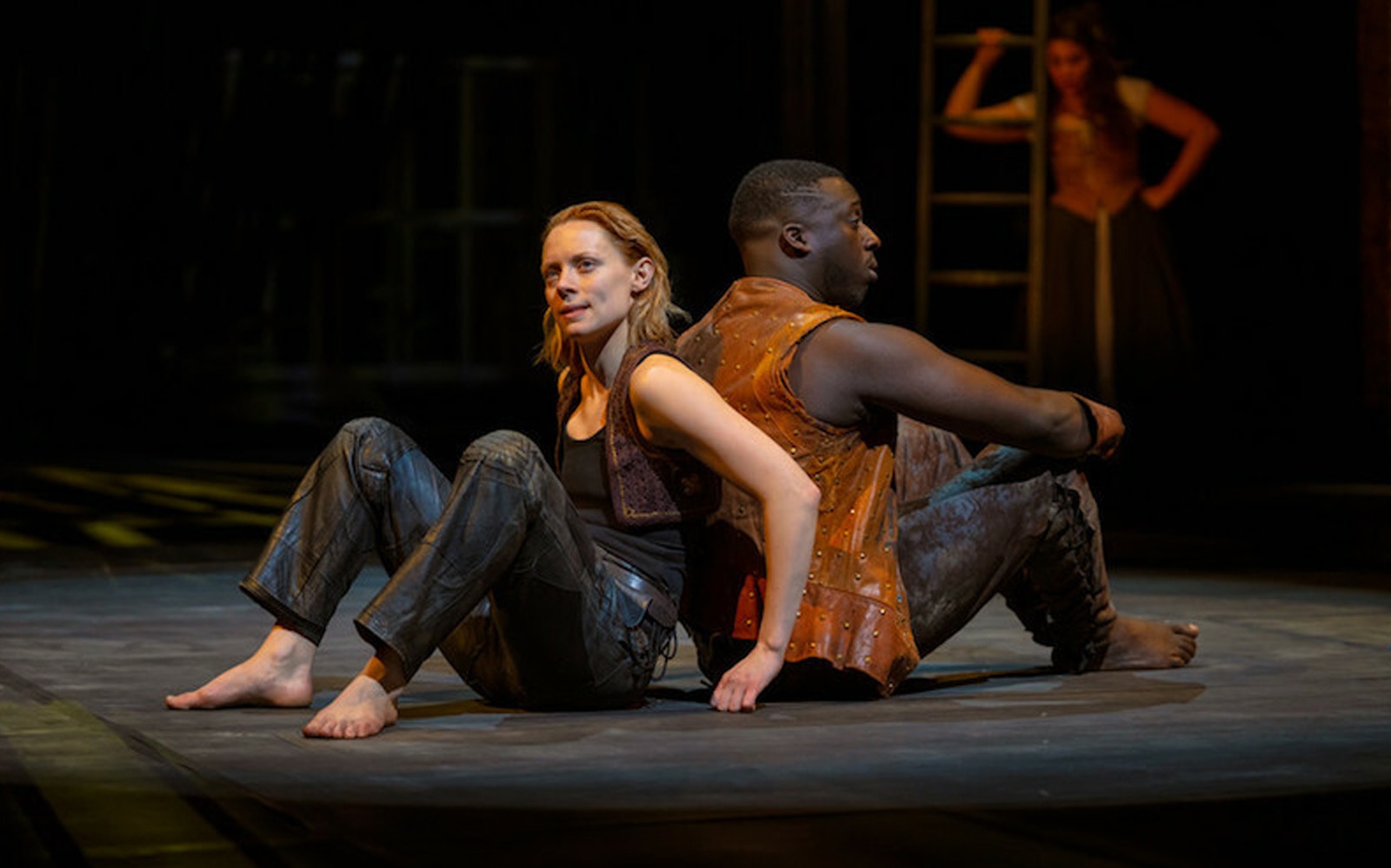 Actors performing a scene from "As You Like It" on stage.