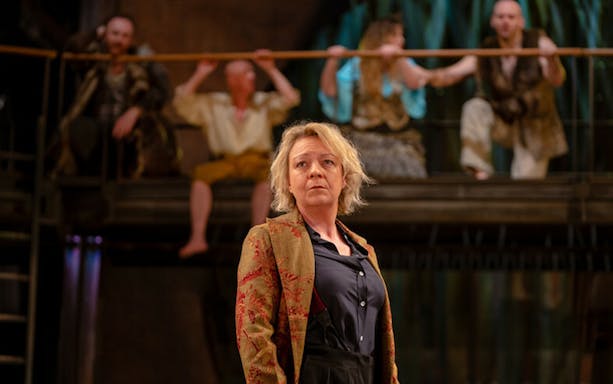 Theater performance of "As You Like It" with actors on stage.