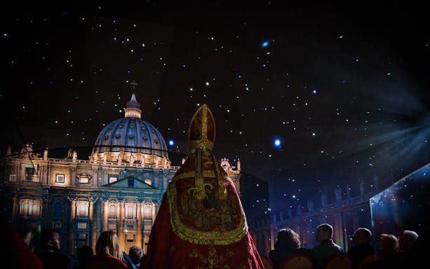 Sistine Chapel Immersive Show with starry sky and audience in Vatican City.