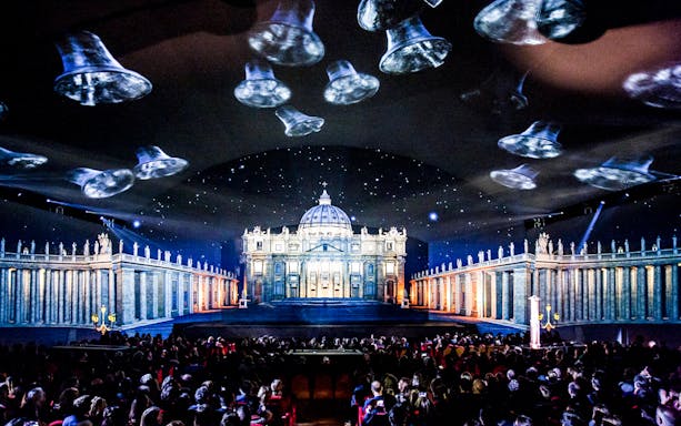 Sistine Chapel Immersive Show with St. Peter's Basilica projection and audience.