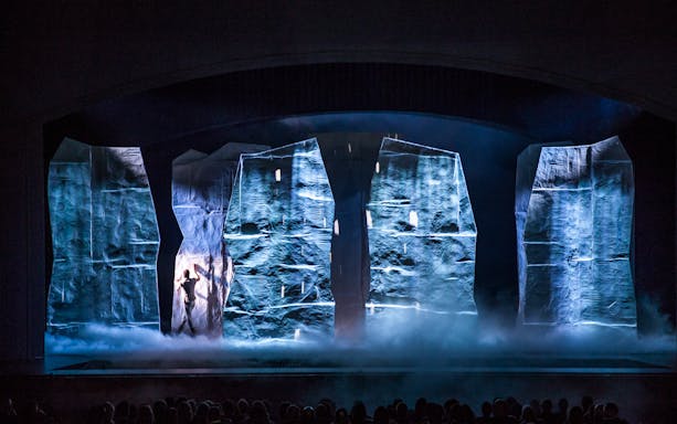 Sistine Chapel Immersive Show with dramatic lighting and performers on stage.