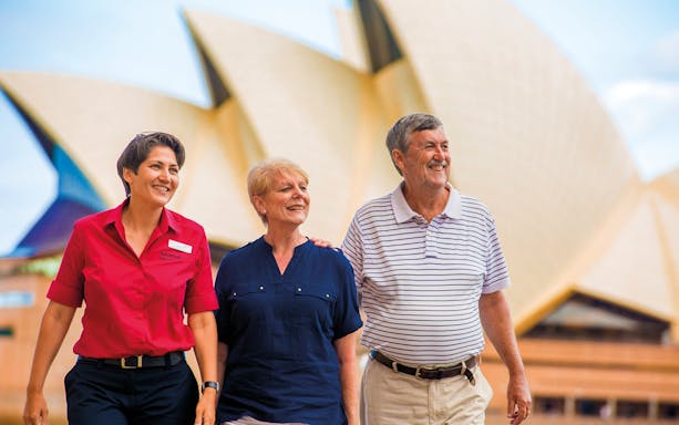 Tour group walking near Sydney Opera House on Sydney and Bondi tour.