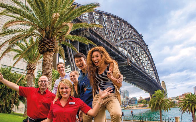 Group of tourists under Sydney Harbour Bridge during Sydney and Bondi tour.