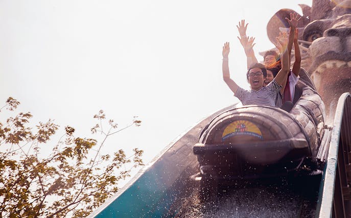 Visitors enjoying a log flume ride at Siam Park City, Bangkok.