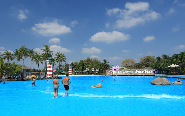 Siam Park City wave pool with people enjoying the water, Bangkok, Thailand.