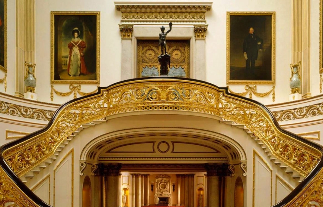 Buckingham Palace state rooms interior with ornate staircase and paintings, London guided tour.
