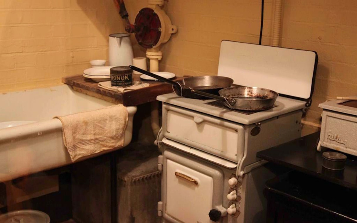 Churchill War Rooms kitchen with vintage stove and sink, London WWII tour.