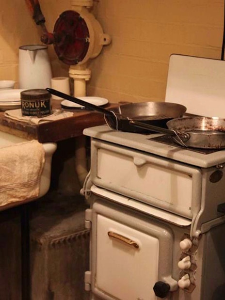 Churchill War Rooms kitchen with vintage stove and sink, London WWII tour.