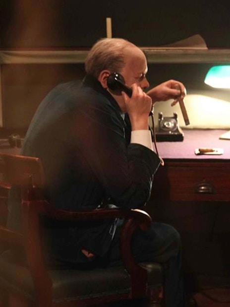 Man in WWII-era office using a phone, part of Churchill’s War Rooms tour.