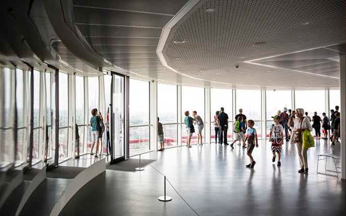 Visitors enjoying skyline views from ArcelorMittal Orbit observation deck in London.