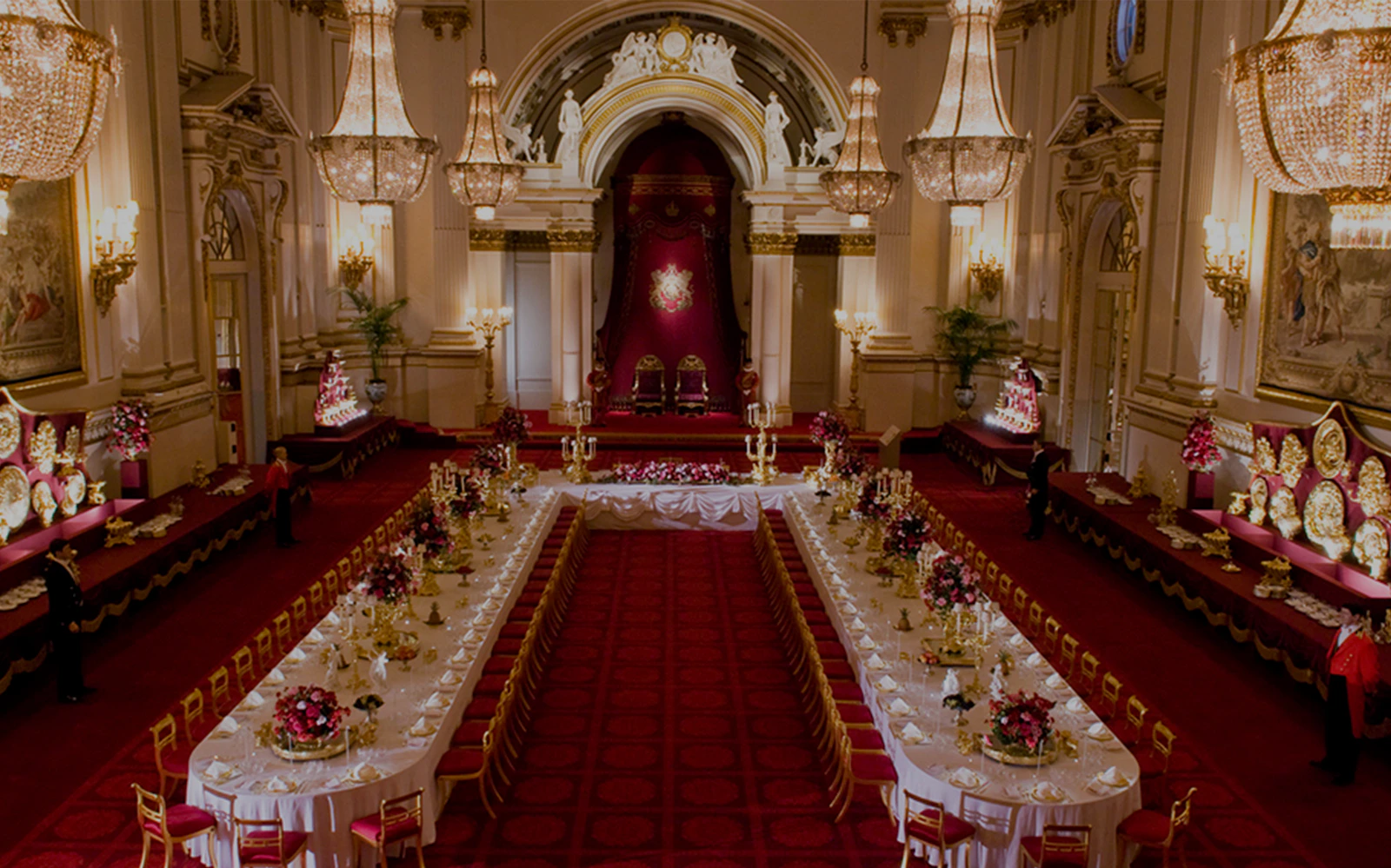 Buckingham Palace State Rooms banquet hall with chandeliers and long dining tables.