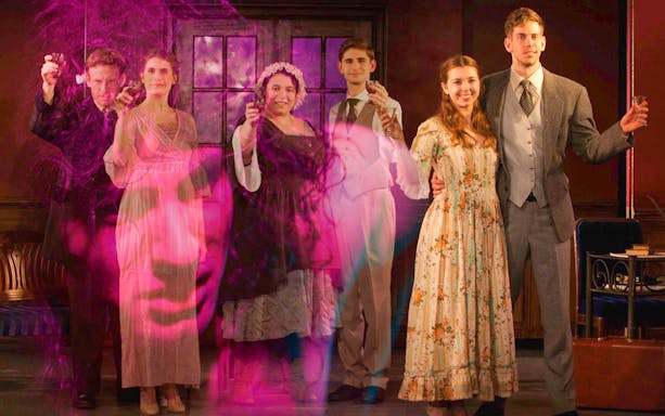 Actors in period costumes on stage with a ghostly face overlay, related to Frankenstein.