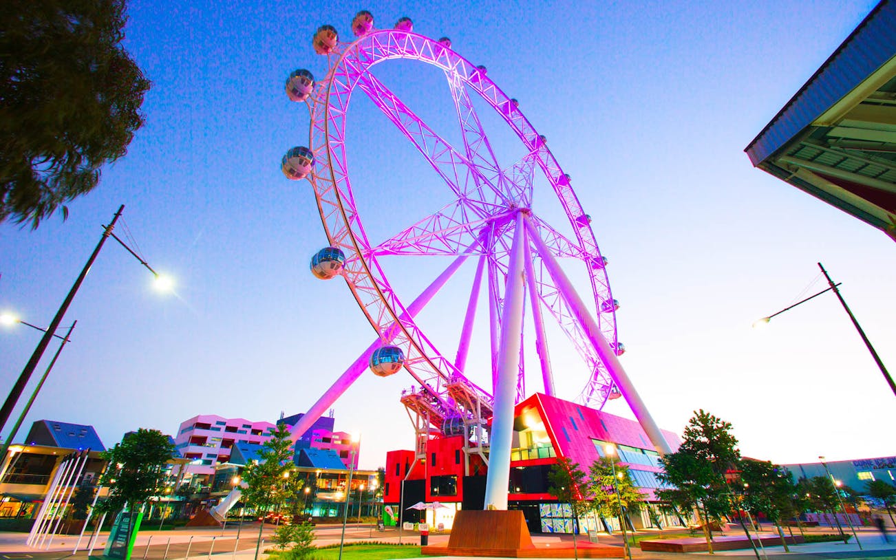 Melbourne Star Observation Wheel illuminated at dusk in Melbourne, Australia.