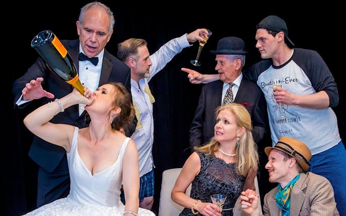 Group of people celebrating with champagne, related to "The Exes" event.