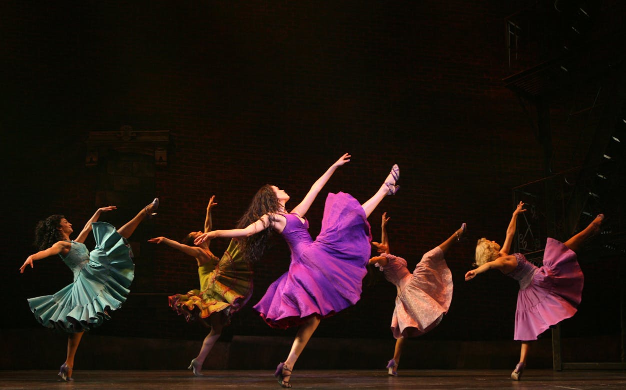 Dancers performing a scene from West Side Story on stage.