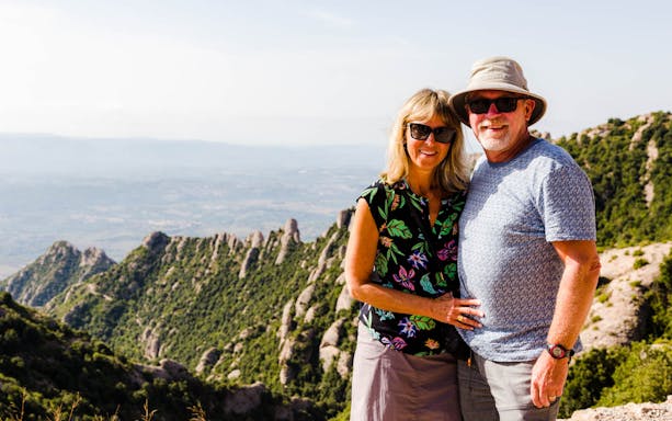 Couple enjoying view of Montserrat mountains on Sagrada Familia & Montserrat tour.