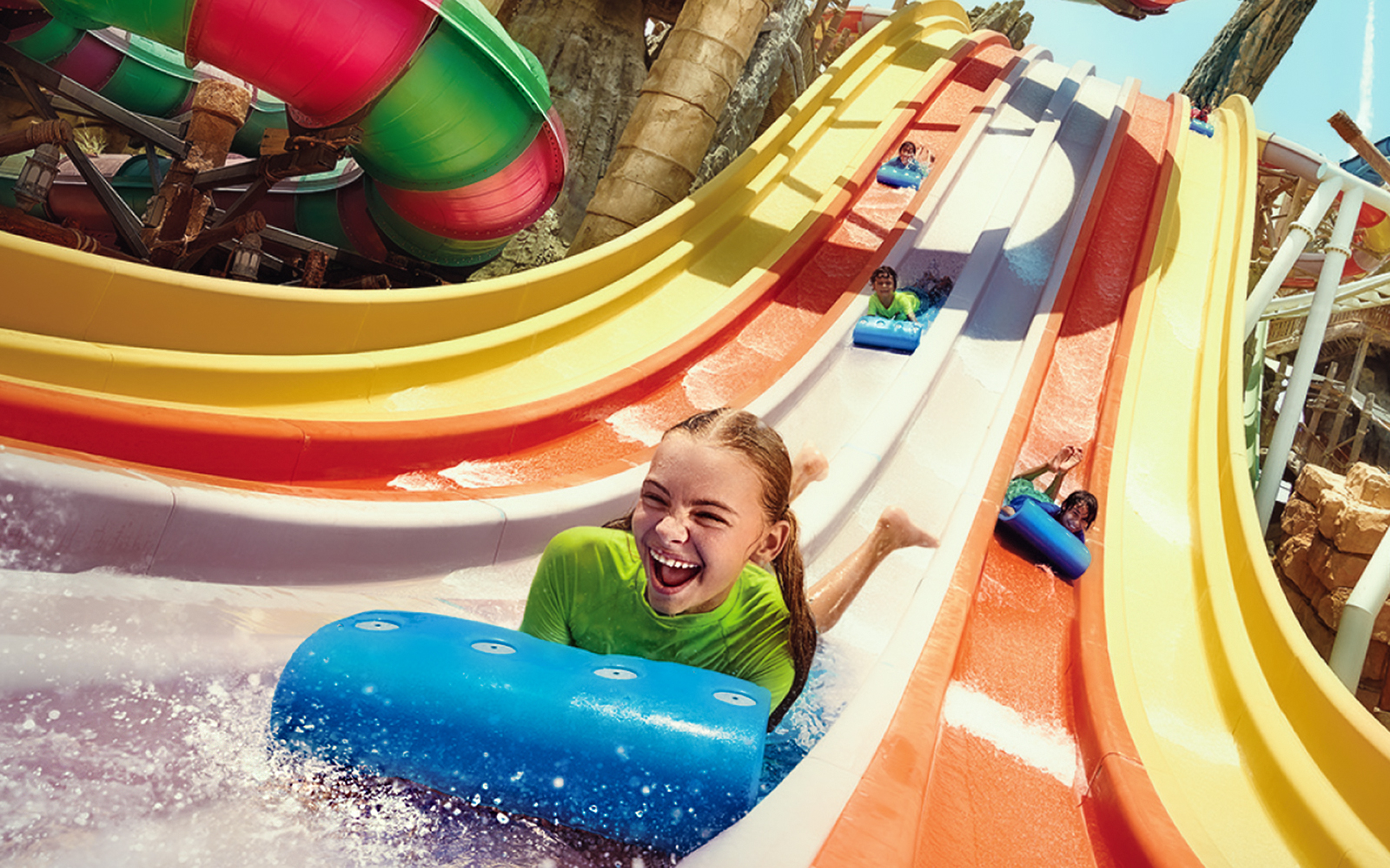 Visitors enjoying water slides at Yas Waterworld, Abu Dhabi.