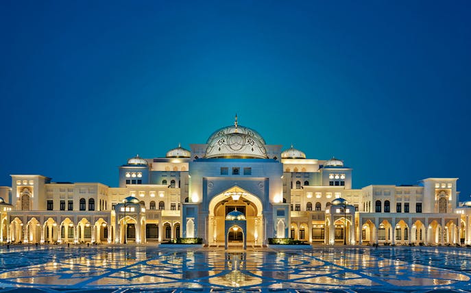 Qasr Al Watan illuminated at night, showcasing its grand architecture in Abu Dhabi.