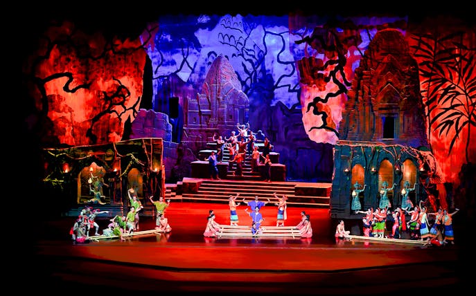 Siam Niramit Bangkok show with performers in traditional costumes on a vibrant stage.