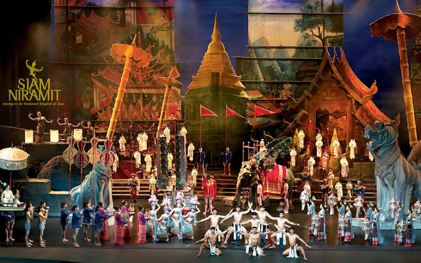 Siam Niramit Bangkok show with performers in traditional costumes on stage.