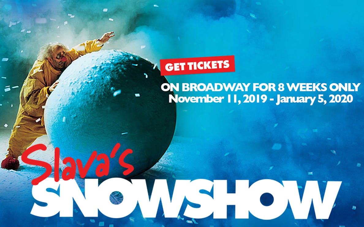 Clown pushing large snowball in Slava's Snowshow on Broadway.