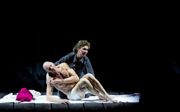 Stage performance of King Lear with two actors in an emotional scene.