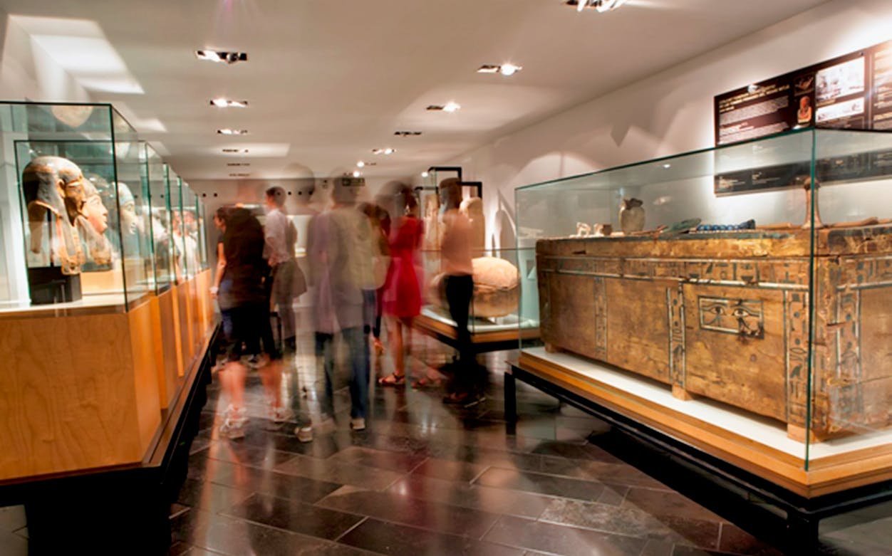 Visitors exploring ancient artifacts at the Egyptian Museum.