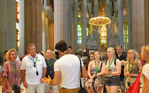 Tour group inside Sagrada Familia with guide, Barcelona.
