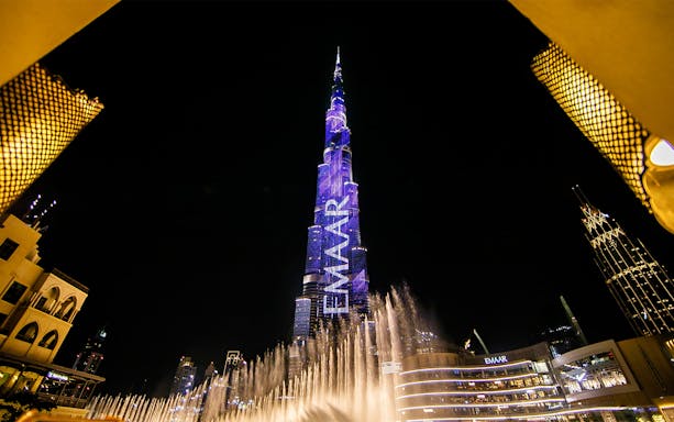 Burj Khalifa illuminated at night with fountain show, Dubai, Explore The Emirates.