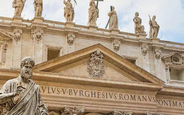 St. Peter's Basilica facade with statues, Vatican City, included in Go Rome City Explorer Pass.