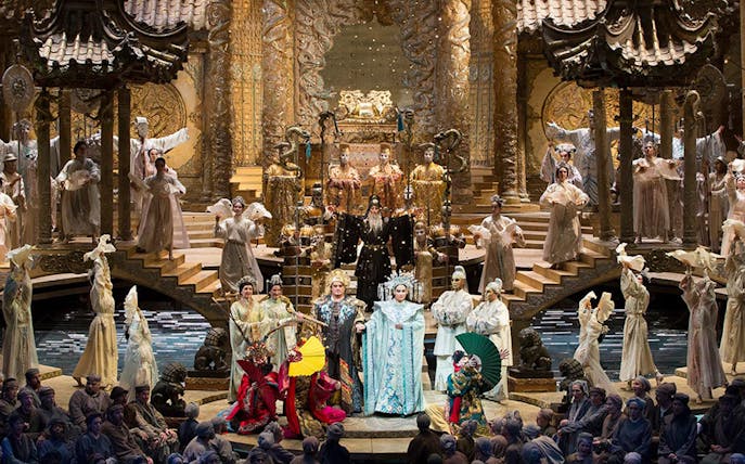 Opera performance of Turandot with elaborate costumes and set design.