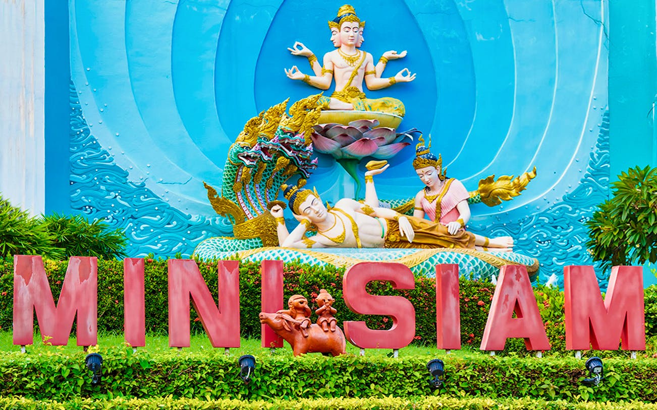 Mini Siam entrance with intricate Thai sculptures, Pattaya, Thailand.
